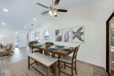 Coastal-inspired dining area with seating for six — perfect for enjoying meals and making memories together.