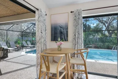 Intimate breakfast nook with serene pool views — a peaceful spot to start your day with a cup a coffee.