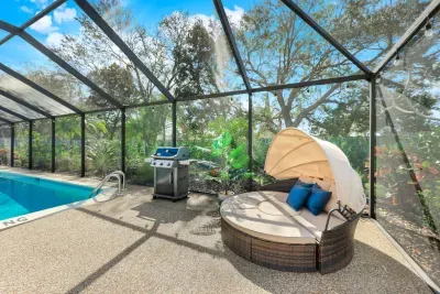 Relax in style by the pool with a shaded daybed and grill — your private retreat for sun, shade, and sizzling BBQs.