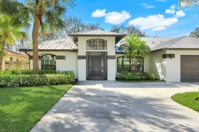 Attractive, sunlit single-story oasis with tropical landscaping—your serene retreat awaits!