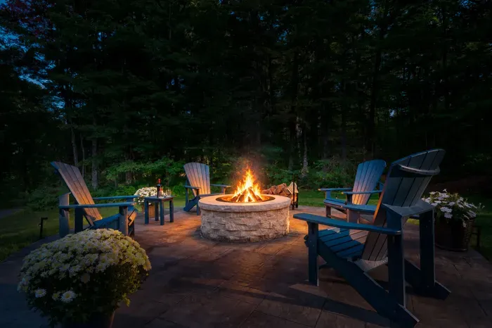 End the day gathered around the fire, surrounded by the quiet of the Vermont woods.
