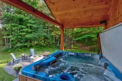 Soak under the trees in your private porch hot tub 🌿—the perfect way to unwind after a day of exploring