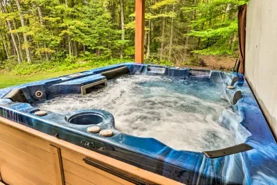 Soak under the trees in your private porch hot tub 🌿—the perfect way to unwind after a day of exploring.