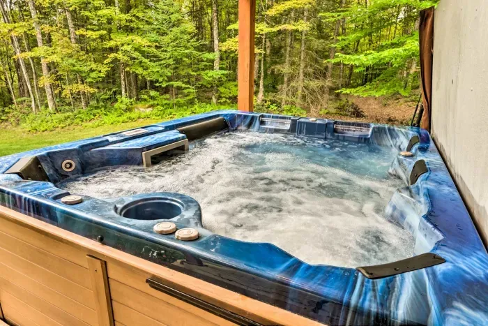 Soak under the trees in your private porch hot tub 🌿—the perfect way to unwind after a day of exploring.