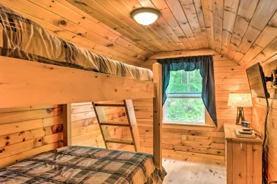 Bunk room, offering plenty of space and warm cabin charm.