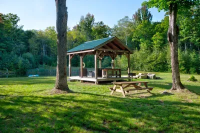 Your go-to spot by the pond—sip, snack, and slow down under the pavilion while the world fades into birdsong and breeze.