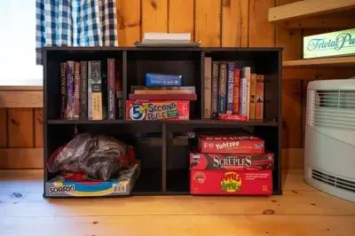 Unplug for a while—games and books are ready for cozy nights and laid-back afternoons at the cabin.