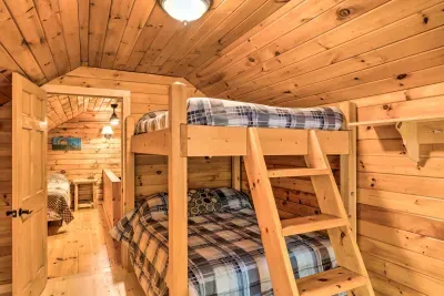 Comfortable upstairs bedroom with full-sized bunk beds—ideal for families with children or groups.