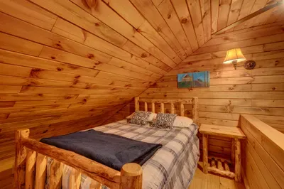 Perched above the main living space, the cozy loft with a queen bed is your invitation to serenity and sweet dreams.