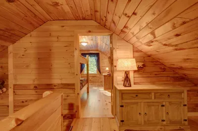 A peek through the loft—warm wood, cozy spaces, and cabin character around every corner.