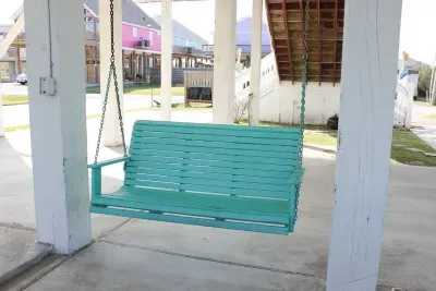 Private patio with picnic table and swinging bench – ideal for morning coffee or evening cocktails