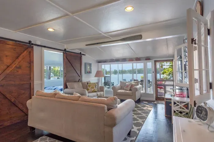 Slice-of-Heaven TC | Spa Retreat | Silver Lake Cottage Hot Tub | Barrel Sauna Full Window Lake Views | Cold Plunge Barrel Living Room looking out over Silver Lake