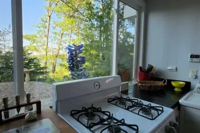 Slice-of-Heaven TC | Spa Retreat | Silver Lake CottageHot Tub | Barrel Sauna Full Window Lake Views | Cold Plunge Barrel Kayaks, canoe, row boat, SUP's all included!Kitchen Lake Views