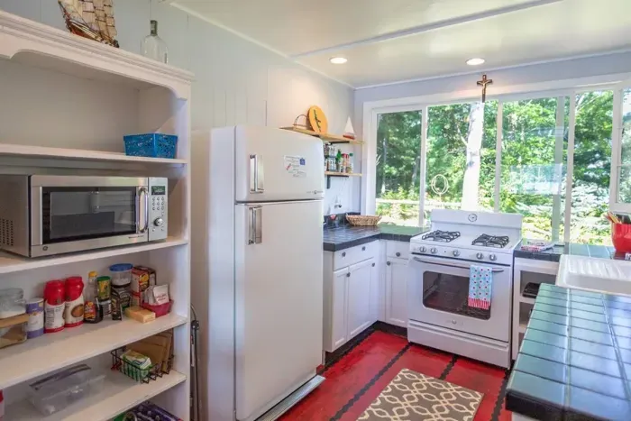 Slice-of-Heaven TC | Spa Retreat Vintage Kitchen Look - Modern Gas Stove-Oven, Microwave, Fridge Freezer Combo, Beverage Cooler, Keurig full pot single cup combo. Bring your own grounds, we provide filters and k-cups to get you started. 