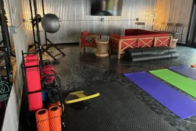 Lake Ann Lodge | Yoga Fitness Studio | Lounge Furniture | Slider Doors to Pool Deck | Exercise Equipment | Hand Weights | Smart TV | Wifi
