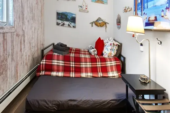 Cozy Twin Trundle with Wooded Views and a Big Screen.
