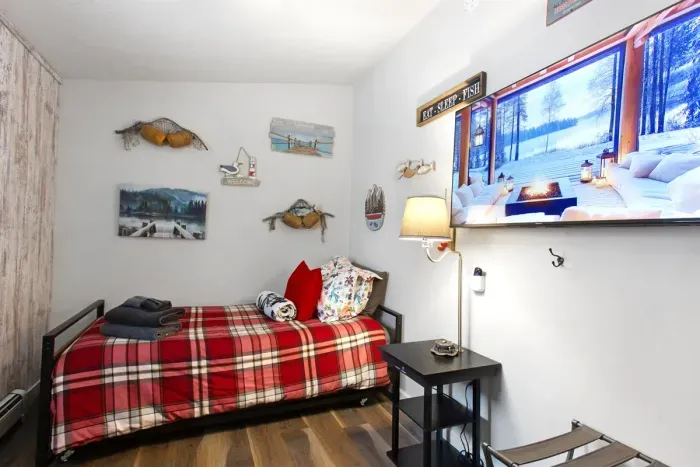 Cozy Twin Trundle with Wooded Views and a Big Screen.