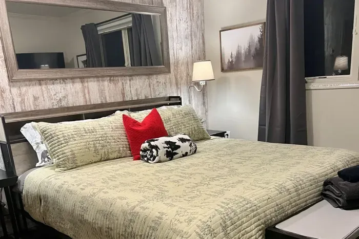 King BR with wooded views and a big screen.TV