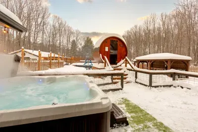 Lake Ann Lodge | Winter Hot Tub | Barrel Sauna Deck Views