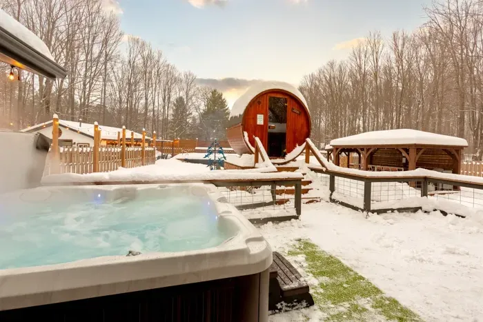 Lake Ann Lodge | Winter Hot Tub | Barrel Sauna Deck Views