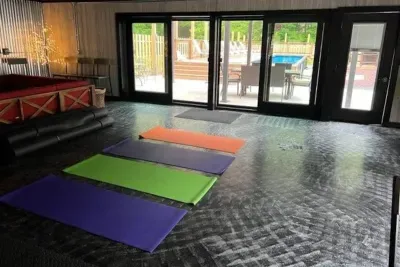 Lake Ann Lodge | Yoga Fitness Studio | Lounge Furniture | Slider Doors to Pool Deck | Exercise Equipment | Hand Weights | Smart TV | Wifi