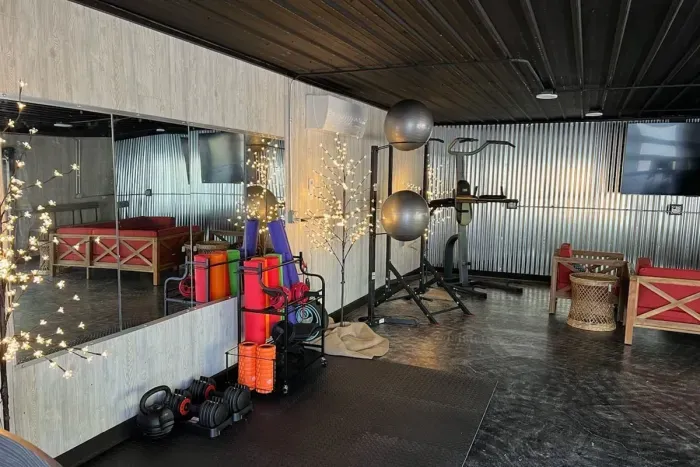 Lake Ann Lodge | Yoga Fitness Studio | Lounge Furniture | Slider Doors to Pool Deck | Exercise Equipment | Hand Weights | Smart TV | Wifi 