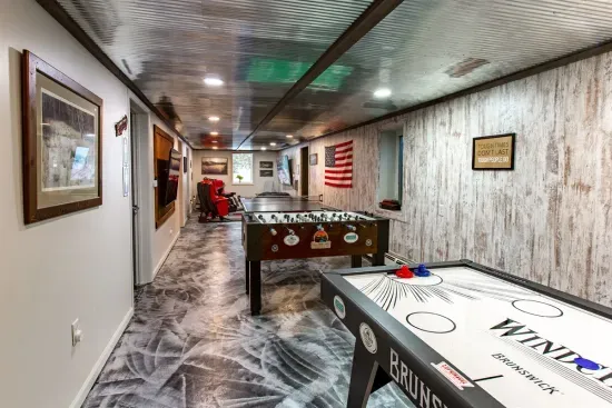 Lower Level game room - Air Hockey, Foosball, Ping Pong, plus Flat Screens for Movies, Gaming and Sports Fans.