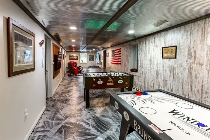 Lower Level game room - Air Hockey, Foosball, Ping Pong, plus Flat Screens for Movies, Gaming and Sports Fans.