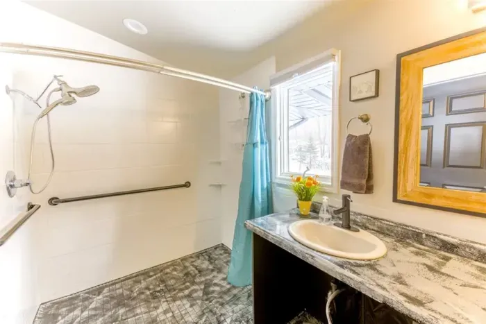 Large Bathrooms wheelchair accessible. This one adjacent to the cozy card room and larger card room with large vanity bar area.