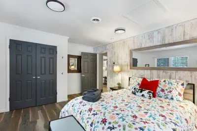 King BR with wooded views and a big screen.TV