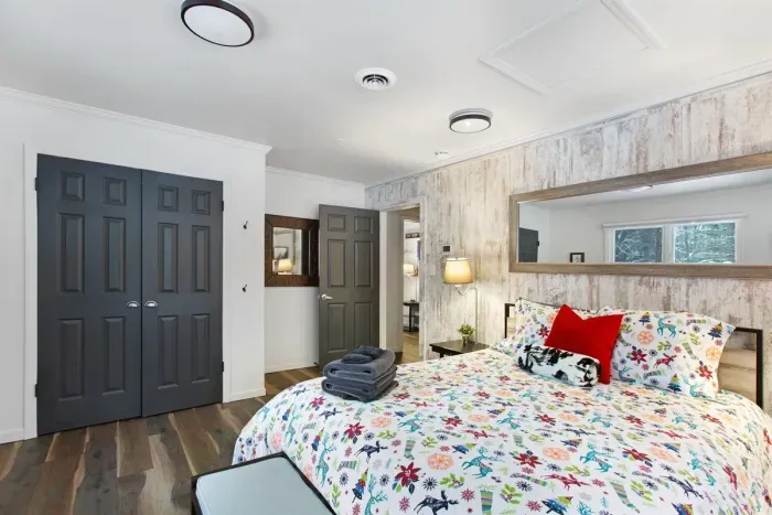 King BR with wooded views and a big screen.TV