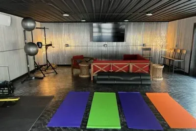 Lake Ann Lodge | Yoga Fitness Studio | Lounge Furniture | Slider Doors to Pool Deck | Exercise Equipment | Hand Weights | Smart TV | Wifi