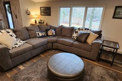 Lake Ann Lodge | Adventure North Vacation Rentals | Cozy Winter Throw Blankets make for great snuggle time on the couch.