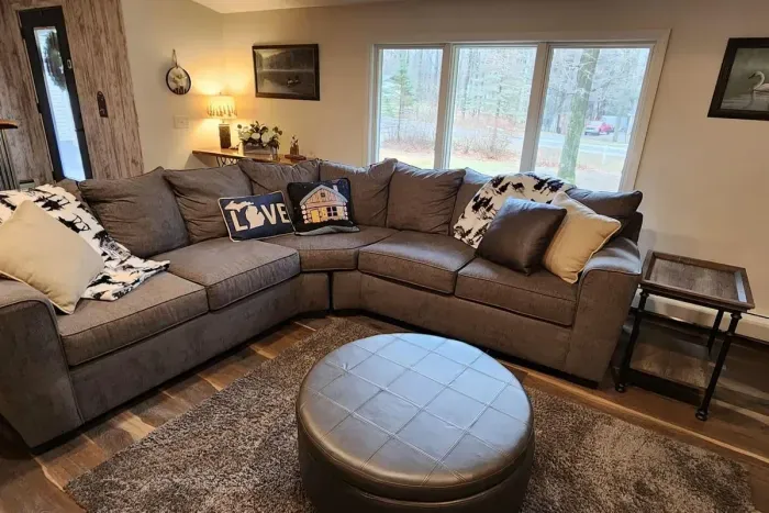 Lake Ann Lodge | Adventure North Vacation Rentals | Cozy Winter Throw Blankets make for great snuggle time on the couch.