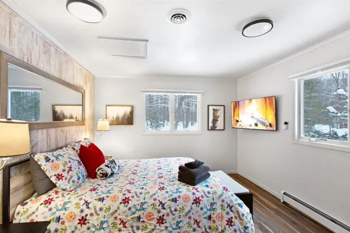 King BR with wooded views and a big screen.TV