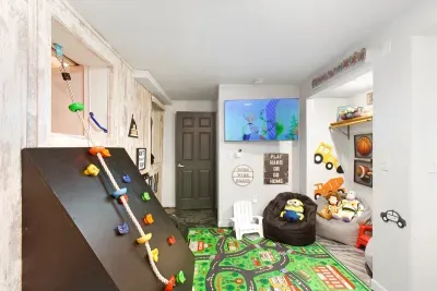 LA Lodge play area complete with Twin over Full Bunkbed House with slide and a climbing rope!