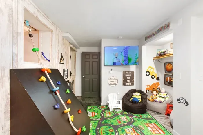 LA Lodge play area complete with Twin over Full Bunkbed House with slide and a climbing rope!