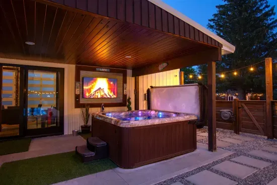 70's Lodge Pool House | Lounge Area | Changing Room | Work-out Equipment | Arcade Games | Indoor- Outdoor Smart TV's | Disco Lights | Radiant Heat | Dry Bar & Bar Stools | Refrigerator | Corn