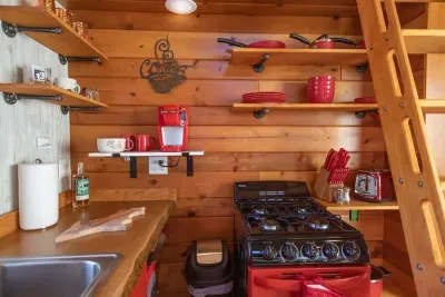 Tiny House - Fully equipped mini kitchen with refrigerator,  gas range and oven, Keurig - K-cup Coffee Maker with a starter K-cups provided.