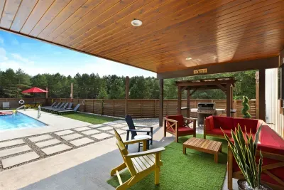 70's Lodge Pool House | Lounge Area | Changing Room | Work-out Equipment | Arcade Games | Indoor- Outdoor Smart TV's | Disco Lights | Radiant Heat | Dry Bar & Bar Stools | Refrigerator | Corn