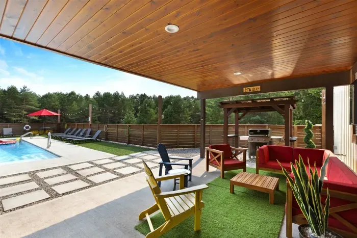 70's Lodge Pool House | Lounge Area | Changing Room | Work-out Equipment | Arcade Games | Indoor- Outdoor Smart TV's | Disco Lights | Radiant Heat | Dry Bar & Bar Stools | Refrigerator | Corn