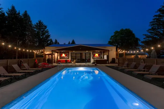 Private heated Pool & Hot Tub with Pool House, Flat Screen TV's, Bar Area & Lounge Seating with plenty of room to recreate indoors. In-ground pool open approximately Memorial Day through Labor