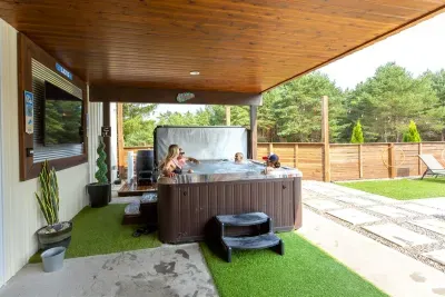 70's Lodge Pool House | Lounge Area | Changing Room | Work-out Equipment | Arcade Games | Indoor- Outdoor Smart TV's | Disco Lights | Radiant Heat | Dry Bar & Bar Stools | Refrigerator | Corn