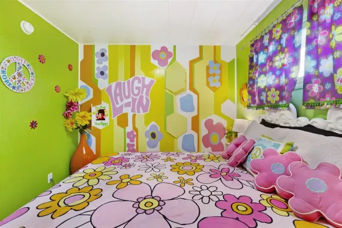 "Laugh In" Queen Bedroom | Main Floor Bedroom Wing, across hall from Blue Green Flower Pops Full Bathroom, between Partridge Family Bedroom Suite and Charlie's Angels Trundle Bedroom