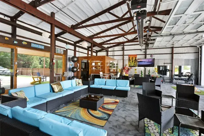 70's Lodge Pool House | Lounge Area | Changing Room | Work-out Equipment | Arcade Games | Indoor- Outdoor Smart TV's | Disco Lights | Radiant Heat | Dry Bar & Bar Stools | Refrigerator | Corn