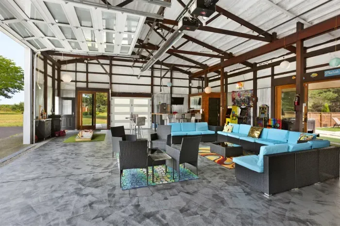 70's Lodge Pool House | Lounge Area | Changing Room | Work-out Equipment | Arcade Games | Indoor- Outdoor Smart TV's | Disco Lights | Radiant Heat | Dry Bar  +Ice | Refrigerator | Corn Hole  