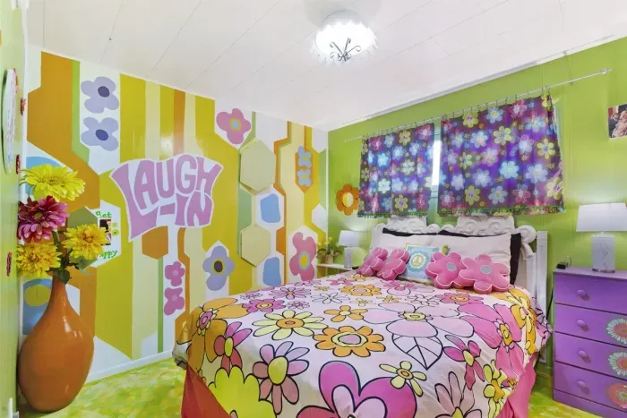 "Laugh In" Queen Bedroom | Main Floor Bedroom Wing, across hall from Blue Green Flower Pops Full Bathroom, between Partridge Family Bedroom Suite and Charlie's Angels Trundle Bedroom