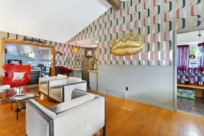 Whiskey Bar Lounge | Main Floor, adjacent to Living Room and the Grand Recreation Room | Gas Fireplace | Hot Tub Views