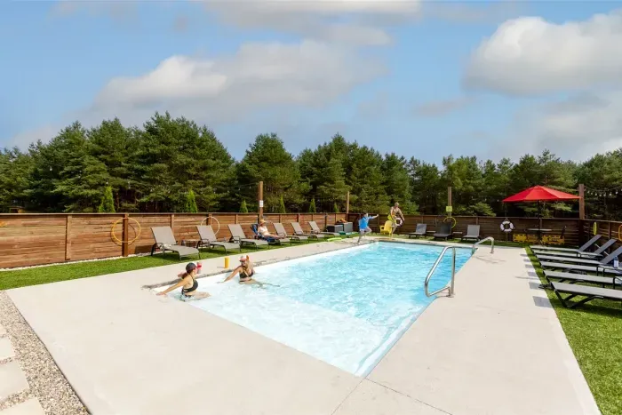 Private heated Pool & Hot Tub with Pool House, Flat Screen TV's, Bar Area & Lounge Seating with plenty of room to recreate indoors. In-ground pool open approximately Memorial Day through Labor