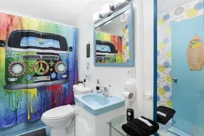 Blue Green Flower Pops Bathroom | Main Floor Bedroom Wing, adjacent to Marsha Brady Queen Bedroom & across the hall from Laugh-in Queen Bedroom & Charlie's Angels Twin Trundle bedroom